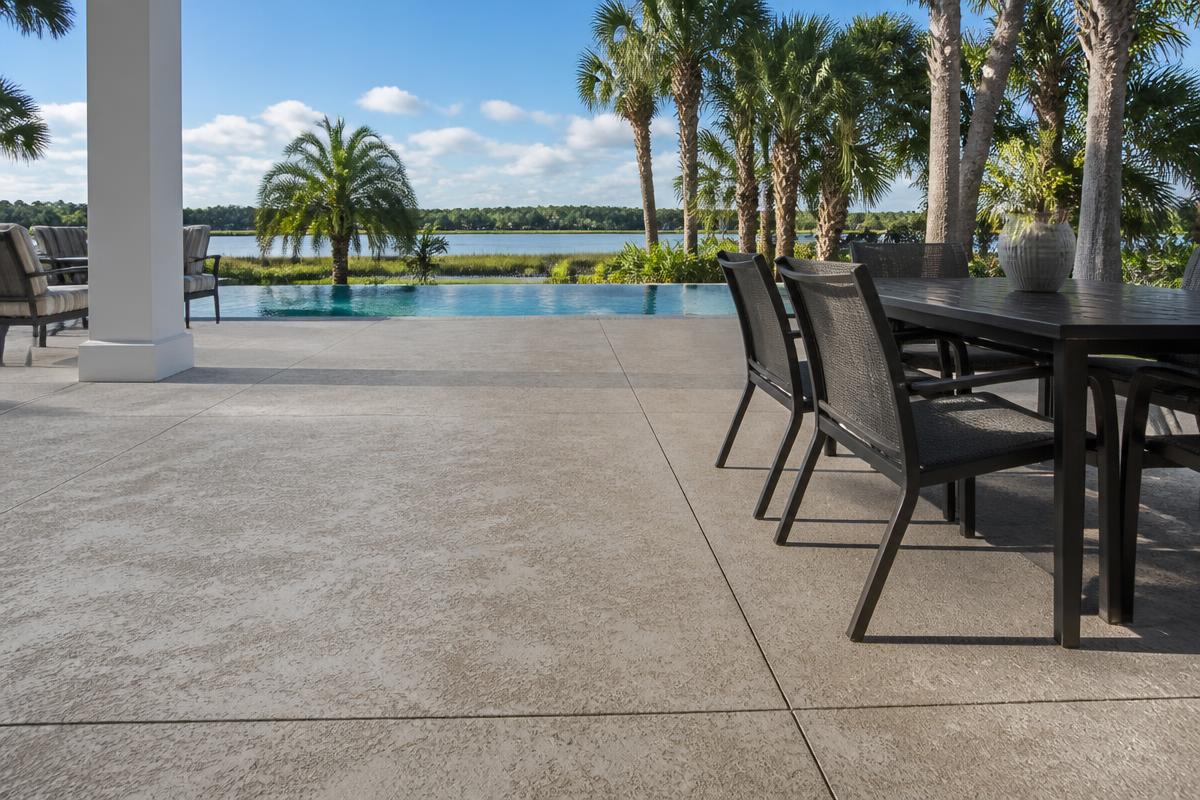 Decorative textured concrete patio by a pool